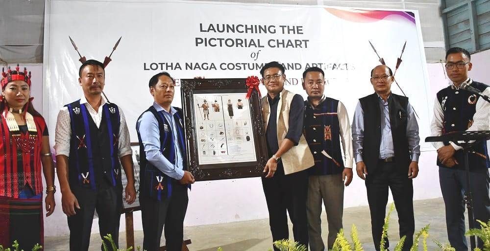 Advisor Mhathung Yanthan launches the pictorial chart on Lotha Naga costumes and artefacts at Wokha on May 9. (DIPR Photo)